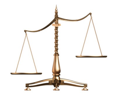 Brass Scales Of Justice Off Balance, Symbolizing Injustice, Over White