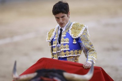 Bullfighter Sergio Aguilar performs a pass during a bullfight at Las Ventas, Madrid (Source: Reuters)