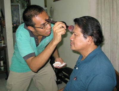 It may seem flaky but it ain't. Properly touching up an interview subject's face is essential if he is not to look greasy on camera.   