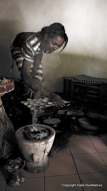 Ethiopian coffee ceremony - A beautiful woman serving coffee in true traditional Ethiopian fashion in Addis Ababa.