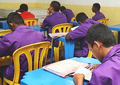 Source Pic: The Star. Hard work: Juveniles in a 3M class in the Kajang Prison. Those in purple uniforms are under remand while those in red are serving their sentence.