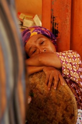 A woman dreaming about travelling in a market in Yogyakarta. | Credit: Ka Ea