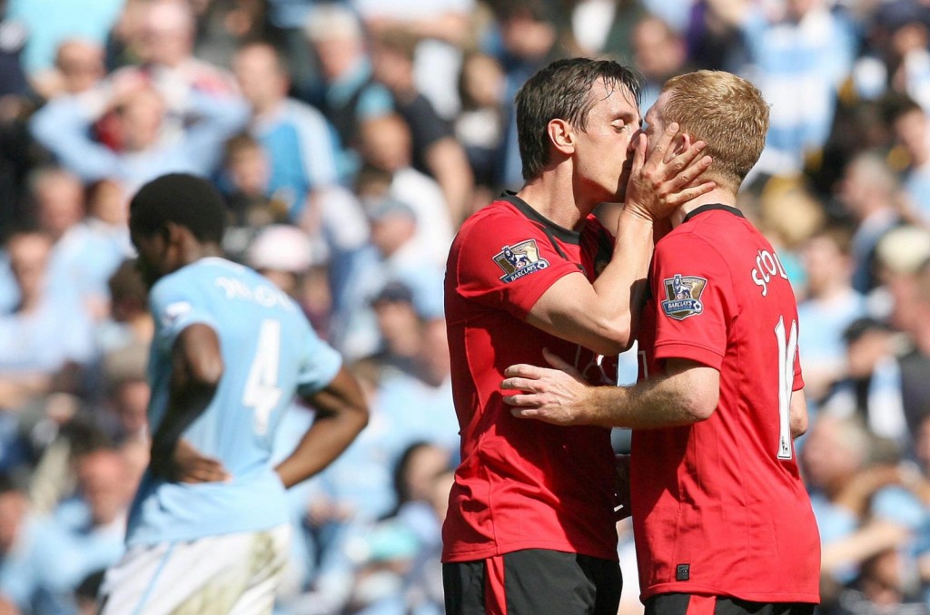 Gary (left) plants a juicy one on the Ginger Genius, Scholesey.
