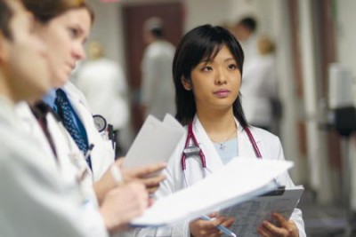 female medical student listens intently