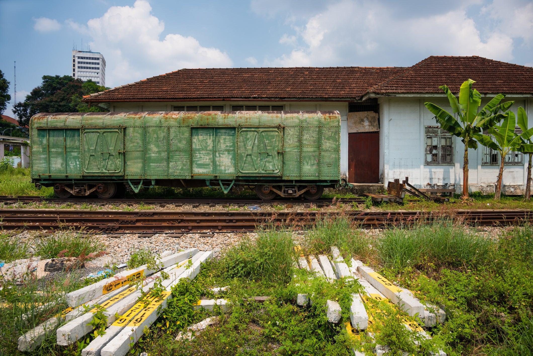 Distressed boxcar at Segamat station - Stephane_Jaquemet/iStock/Getty Images
